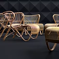 Modern Rattan Woven Leisure Chairs In Stylish Display With Dark Geometric Wall