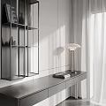 Modern Bookshelf With Open Shelves And Side Table Featuring Table Lamp And Stacked Books