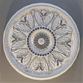 Decorative Circular Component With Intricate Carved Flower And Leaf Patterns And Beaded Border Design