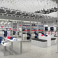 Modern Clothing Store Interior with Hanging Apparel Shelves Display Tables and Colorful Outfits