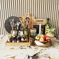 Organized Kitchen Utensils On Marble Countertop With Wooden Background Spice Bottles And Fresh Apples