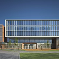 Modern Office Building With Glass Curtain Wall Adjacent Structure Front Lawn And Pathway
