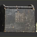 Ancient Wooden Chest With Carved Symbols And Small Figurine Decoration