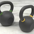 Two Black Kettlebells With Green And Yellow Rings For Fitness On Marble Surface