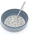 Creamy Oatmeal in Blue Bowl with Moon Circle Patterns and Silver Spoon