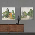 Landscape Wall Art Paintings Featuring Trees Houses Road Hanging on Gray Wall Above Wooden Cabinet