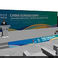China Eurasia Expo Conference Venue With Podium Backdrop Tables Chairs And Water Bottles