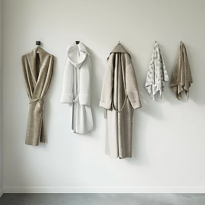 Soft and Cozy Bathroom Accessories Hanging Robes and Towels in Various Neutral Colors on Wall 3d model