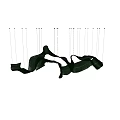 Modern Green Streamlined Chandelier With Glowing Accents Against Black Background