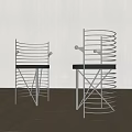 Modern Dining Chairs With Spiral Metal Frame And Black Seats On Wooden Floor