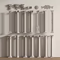 White Columns With Various Designs And Decorative Capitals Arranged On Wall And Floor
