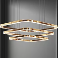 Elegant Modern Gold Three Tier Ring Chandelier Hanging In Interior Space