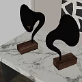 Modern Black Horn Shaped Speakers With Wooden Bases On Marble Tabletop