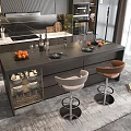 Modern Bar Counter With Dark Surface Fruits Wine Glasses Plates And Two High Stools