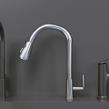 Various Stylish Faucets Displayed On Gray Shelves With Different Designs And Finishes