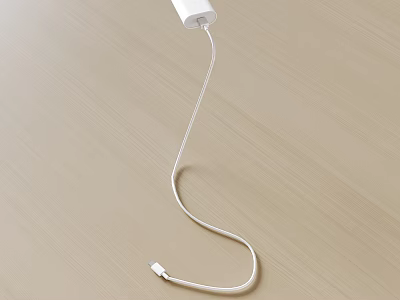 White Mobile Phone Charger With Long Data Cable And USB Connector On Light Wood Desktop 3d model
