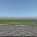 Outdoor Metal Fence With Wooden Floor Grass And Purple Flowers Under Blue Sky