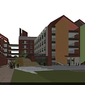 School Campus Buildings With Sports Field Green Areas And Surrounding Trees