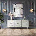 White Entryway Console Table with Three Circular Decor Drawers Gold Wall Lamps and Quilted Art