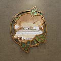 Round Mirror With Golden Frame And Green Leaf Decorations Reflecting Bedroom Bed And Nightstand