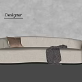 Beige Curved Sectional Sofa With Brown Pillow Gray Blanket In Designer Room And Green Plant