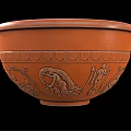 Orange Ceramic Bowl With Ancient Figural Carvings And Decorative Patterns As Household Item