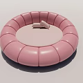 Modern Pink Round Bed Upholstered with Soft Cushions for Cozy Bedroom Interior