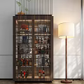 Dark Wooden Wine Cabinet With Glass Doors Holding Bottles And Decorative Items Beside Floor Lamp