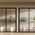Modern Glass Sliding Doors with Black Frames and Indoor Plants on Wooden Floor