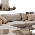Cozy Beige Fabric Sofa With Brown Cushions And Round Coffee Table In Modern Living Interior