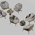 Rattan Outdoor Chairs With Soft Cushions And Round Table Decorated With Fruits And Flowers