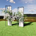 Floral Installation With Black Frame Columns White Lavender Flowers Circular Decorations On Green Grassland