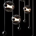 Three Illuminated Black Transparent Spherical Pendant Lights With Metal Rods And Small Metal Balls