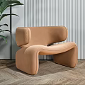 Modern Tan Accent Chair With Unique Curved Shape Vertical Striped Wall And Green Plant