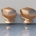 Golden Hinged Door Handles Pair With Shiny Finish On Light Background
