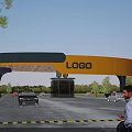 Modern Entrance Gate With Yellow And Gray Structure LOGO Vehicles Trees And Parking Area