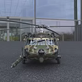 Military Helicopter With Camouflage Paint Parked On Gray Ground Featuring Main Rotors And Tail Rotor