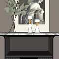 Modern Bedside Table With Gold Accents Green Plant White Vases And Framed Sculpture Artwork On Paneled Wall