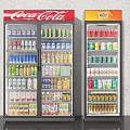 Coca Cola and Fanta Branded Beverage Refrigerators Fully Stocked with Various Drinks