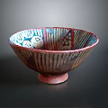 Decorative Ceramic Bowl With Colorful Geometric Patterns And Stripe Details On Stable Base