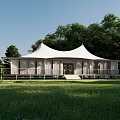 White Tent Style Hotel Building Surrounded by Green Grassland and Trees