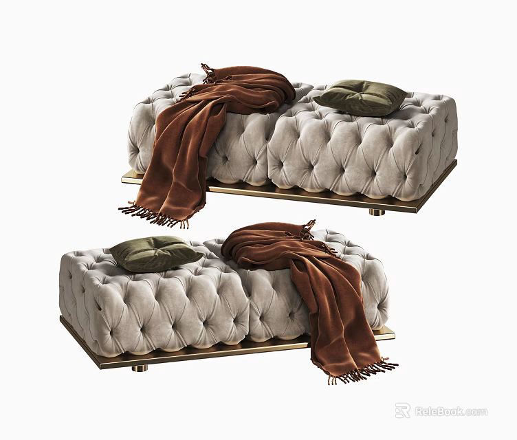 Light Colored Tufted Ottoman With Gold Metal Legs Brown Blanket And Green Cushion 3d model 