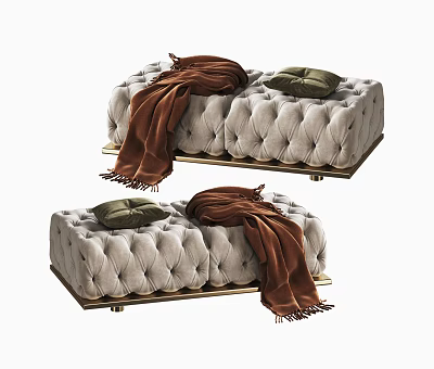 Light Colored Tufted Ottoman With Gold Metal Legs Brown Blanket And Green Cushion 3d model