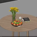 Fruit Bowl on Round Wooden Table With Yellow Calla Lilies Vase Notebook and Decorative Ball