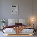 Double Bed With White Headboard Brown Blanket Pink Pillows Framed Painting Sunlight And Sea View