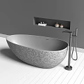 Round Gray Stone Bathtub in Modern Bathroom Interior with White Wooden Floor and Wall Niche