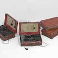 Vintage Communication Devices In Leather Cases With Headphones Open And Closed