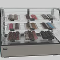 Dessert Display Case With Assorted Pastries On Glass Shelves And Stainless Steel Base