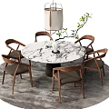 Stylish Round Marble Table And Wooden Chairs Set With Lantern Pendant Light And Green Plant
