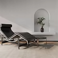 Modern Leather Chaise Lounge With Metal Frame Side Table And Potted Plant In Arched Niche